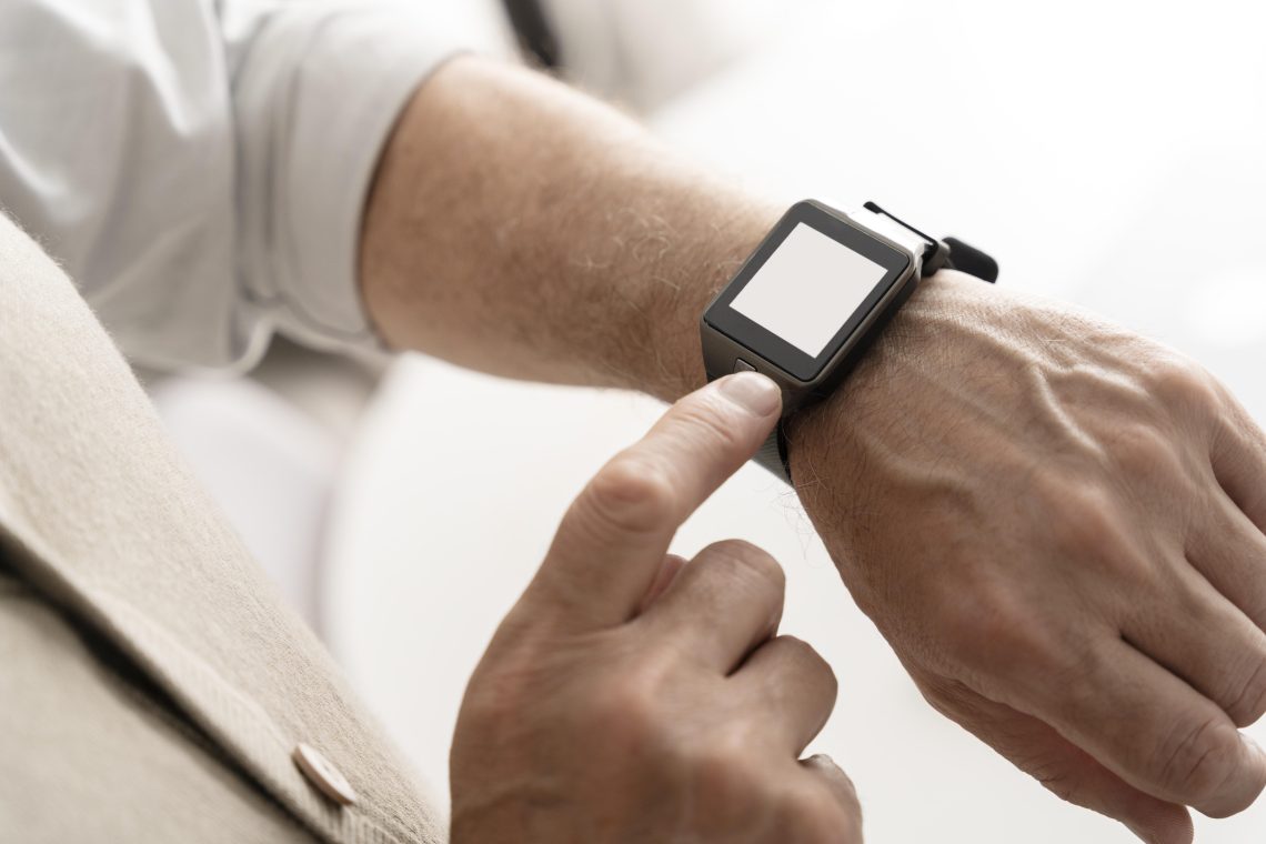 a hand wearing watch for time tracking